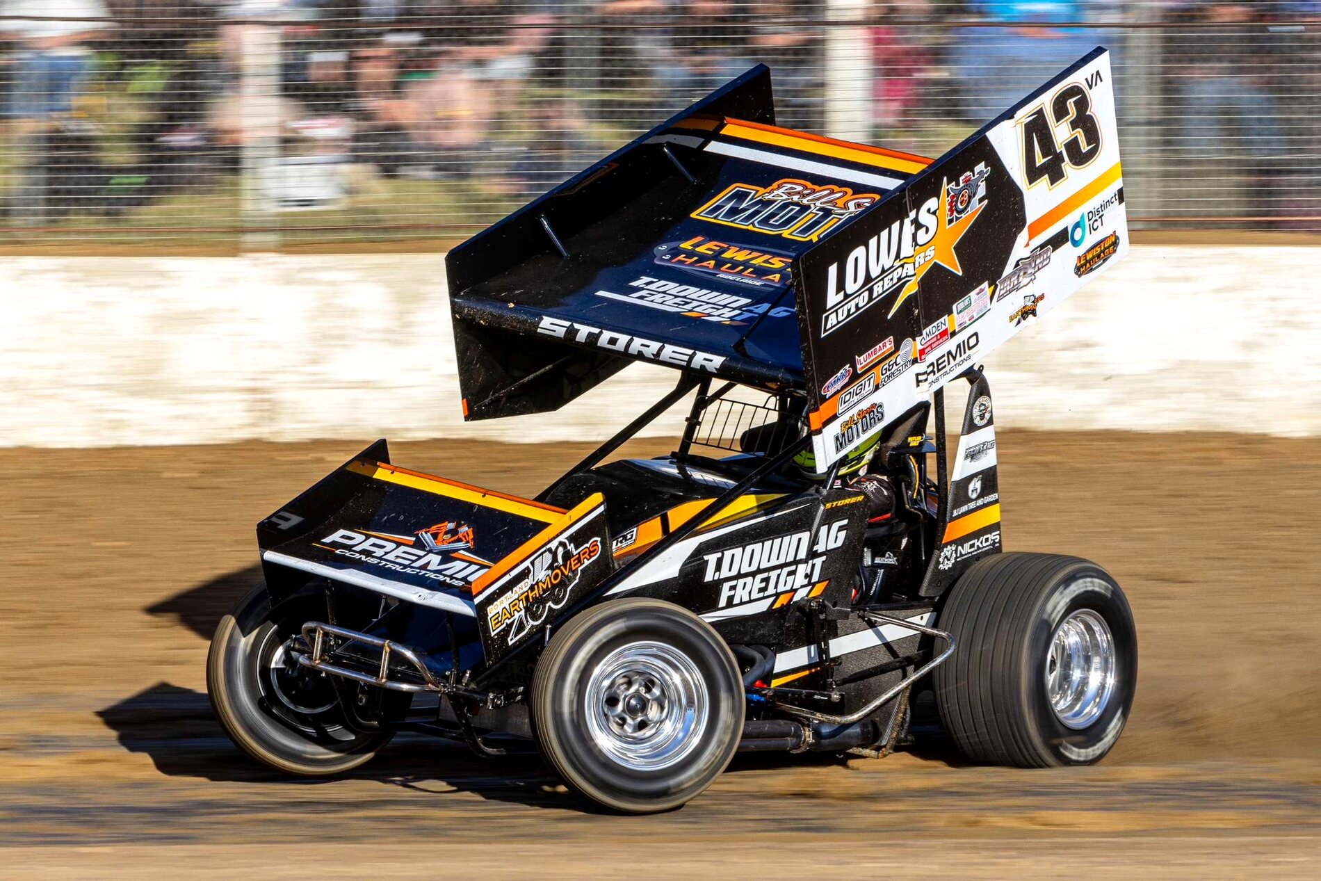Daniel Storer's #43 Sprintcar at full speed in front of a packed crowd